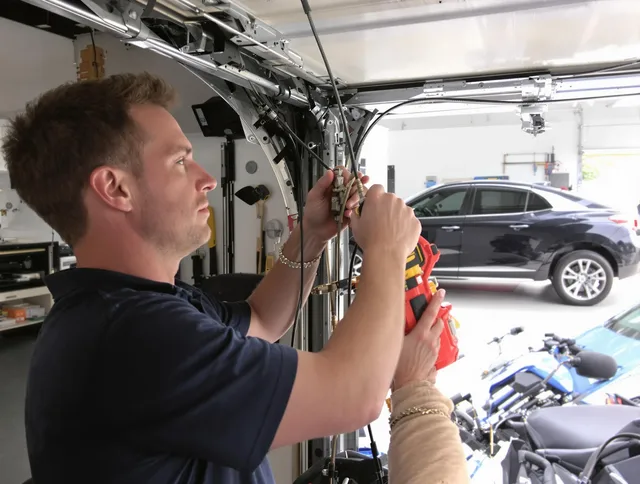 Fontana Garage Door Repair safety certified technician performing cable replacement in Fontana