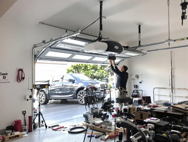 Fontana Garage Door Repair specialist installing smart garage door opener system in Fontana home